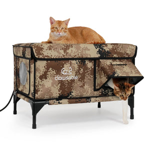 Two cats using camouflage outdoor heated cat house (dual-entry for pets)
