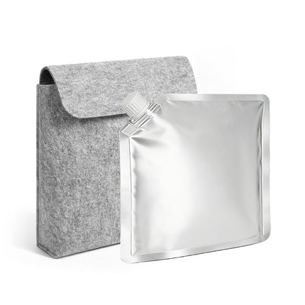 Gray felt pouch next to a silver foil pouch on a white background
