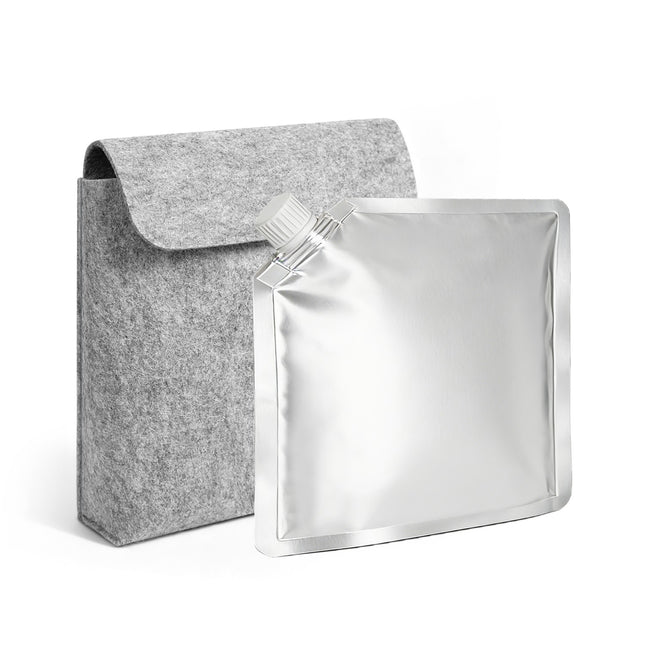 Gray felt pouch next to a silver foil pouch on a white background
