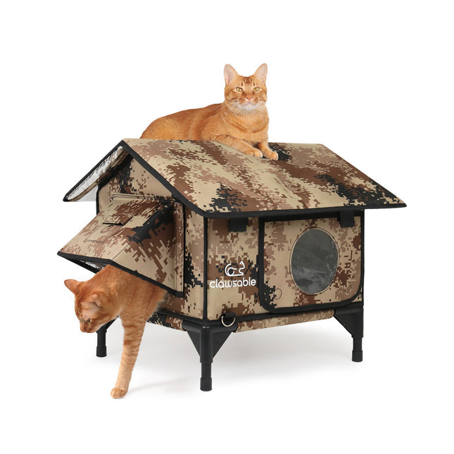 Camouflage cat house with two cats on a white background
