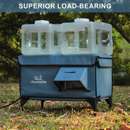 Portable pet washing station with water jugs on grass, featuring the brand 'clawsable'.