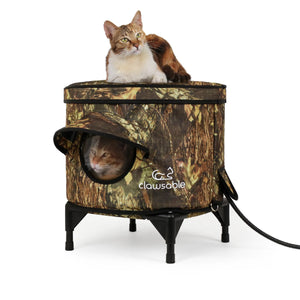 Two cats resting on and inside a heated outdoor cat house, waterproof and insulated design keeps pets warm and cozy during winter