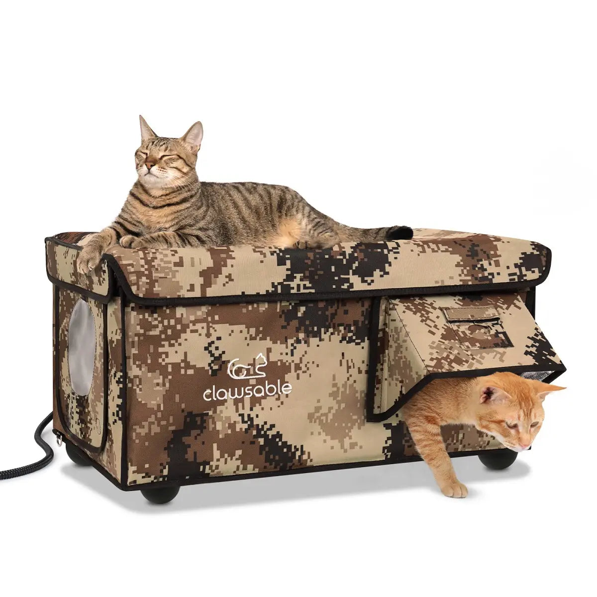 A large heated cat house with two doors, camouflage pattern, and two cats resting on top.