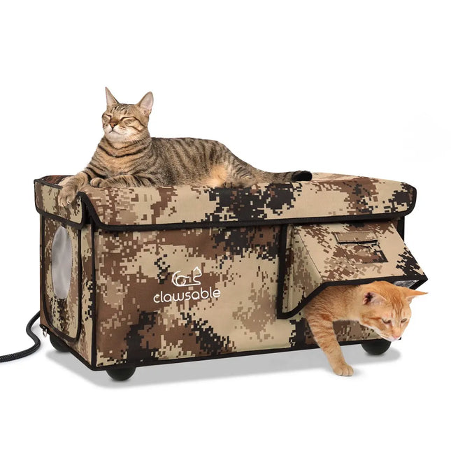 A large heated cat house with two doors, camouflage pattern, and two cats resting on top.